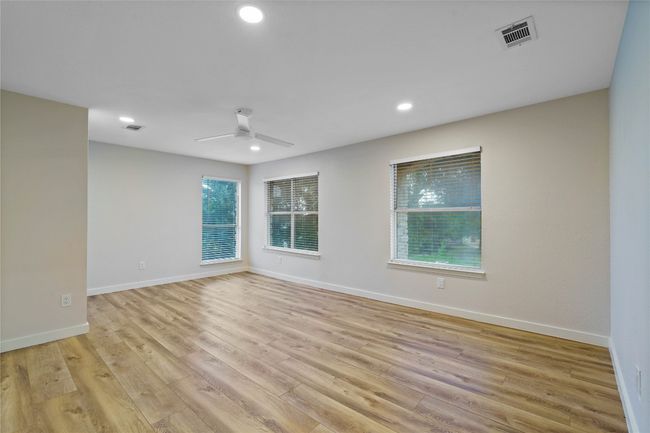 Unfurnished room with recessed lighting, visible vents, ceiling fan, and light wood-style flooring | Image 32