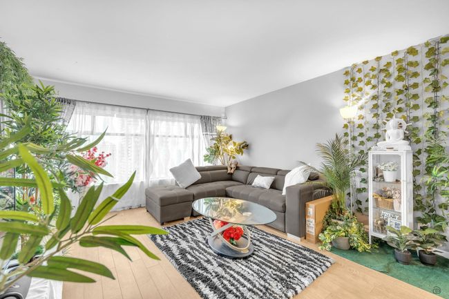 Living area with wood finished floors | Image 14