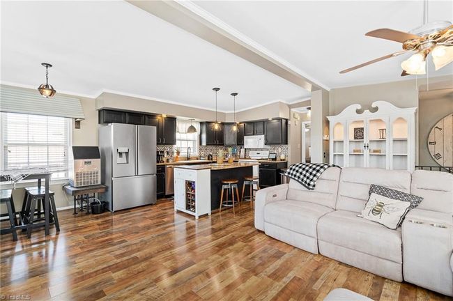 Enjoy the water view while relaxing on the sofa, eating dinner or preparing dinner. | Image 9