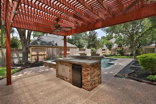 Large pergola, Recent back fence, double fans, cool decking with drains. | Image 36