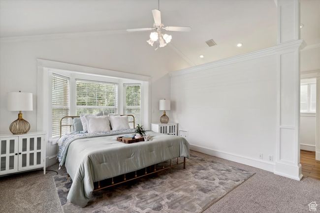 Bedroom featuring vaulted ceiling, crown molding, carpet flooring, a ceiling fan, and recessed lighting | Image 15