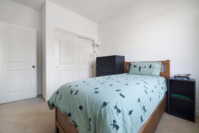 Bedroom featuring baseboards, carpet flooring, and a closet | Image 23