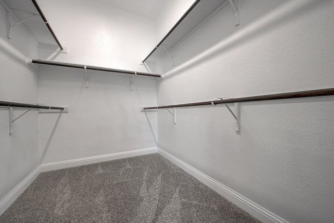 Spacious closet with carpet | Image 15