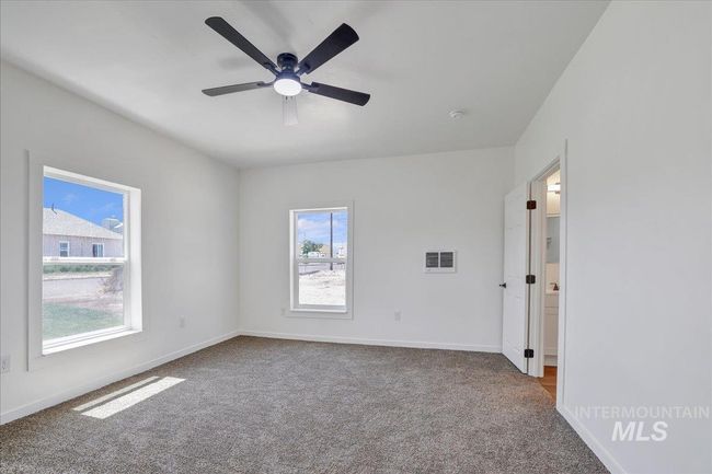Unfurnished room featuring carpet and a ceiling fan | Image 17