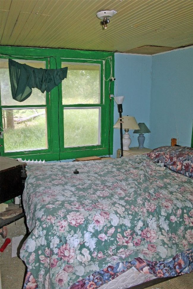 Bedroom featuring wood ceiling | Image 6