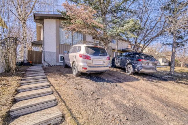 12 Shawmeadows Close Sw, Home with 4 bedrooms, 2 bathrooms and 2 parking in Calgary AB | Image 1