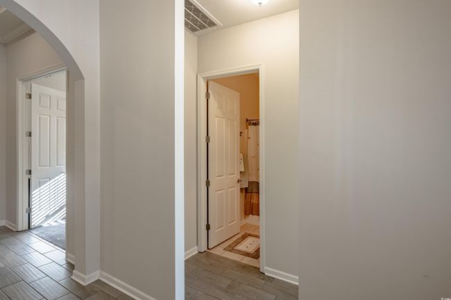 Hallway featuring light hardwood / wood-style flooring | Image 8