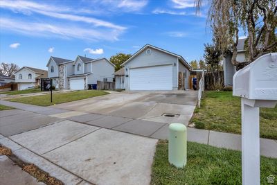 Exterior space featuring a garage and a front yard | Image 3