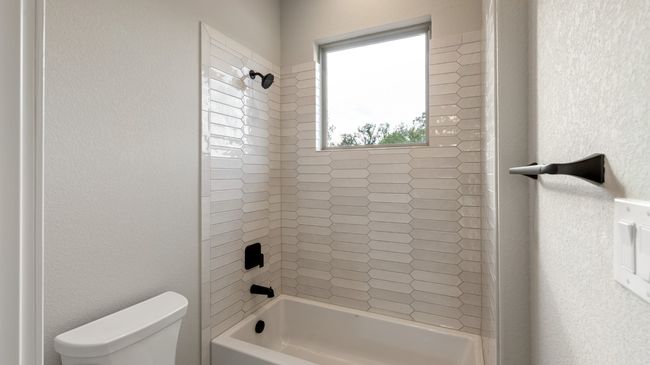 Full bath with a textured wall and shower / washtub combination | Image 38