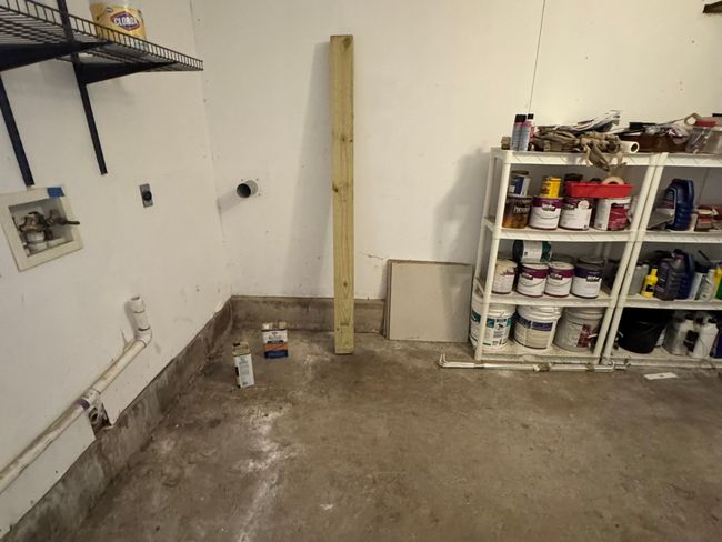 Utility room featuring water heater and heating unit | Image 32