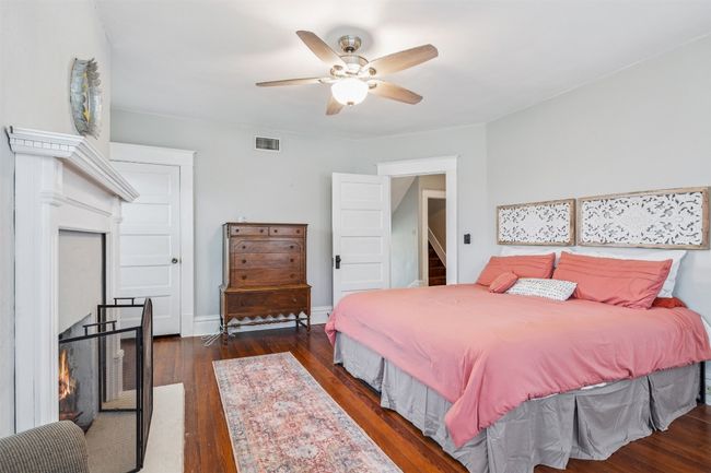 Bedroom with hardwood / wood-style floors and ceiling fan | Image 29