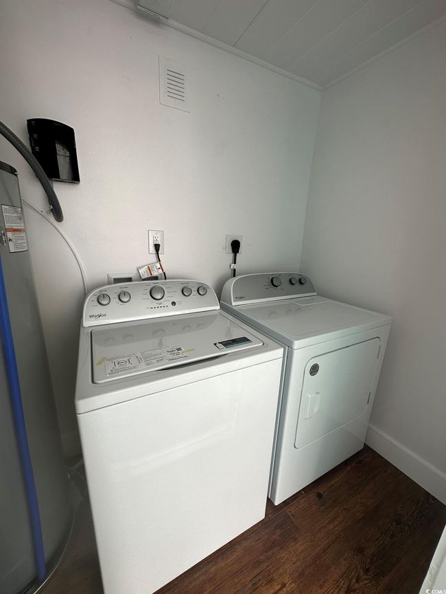 Washroom featuring dark hardwood / wood-style flooring and independent washer and dryer | Image 36