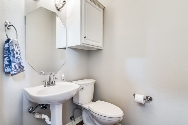 There is a half bathroom downstairs. | Image 16