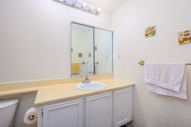 Carpeted spare room featuring baseboard heating, plenty of natural light, and ceiling fan | Image 26