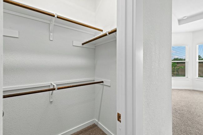 Walk in closet with carpet flooring | Image 24