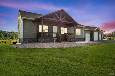 3 car garage with water proof walls, heating, and more. | Image 2