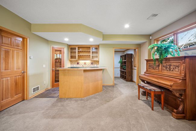 This lower level is an entertainer's dream, featuring heated flooring for year-round comfort. | Image 23