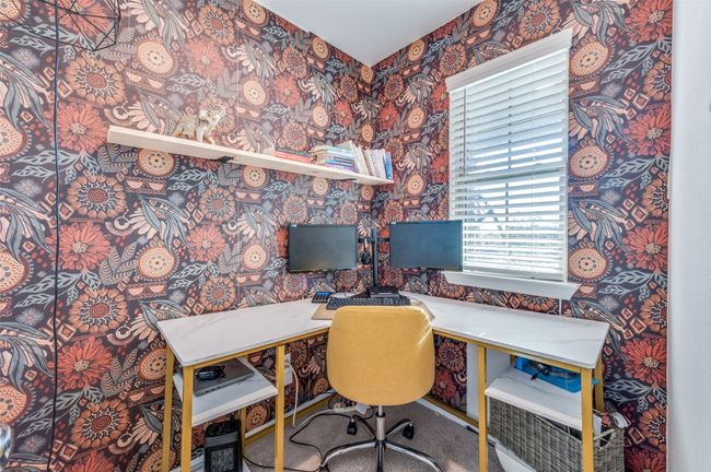 Office space featuring wallpapered walls | Image 12
