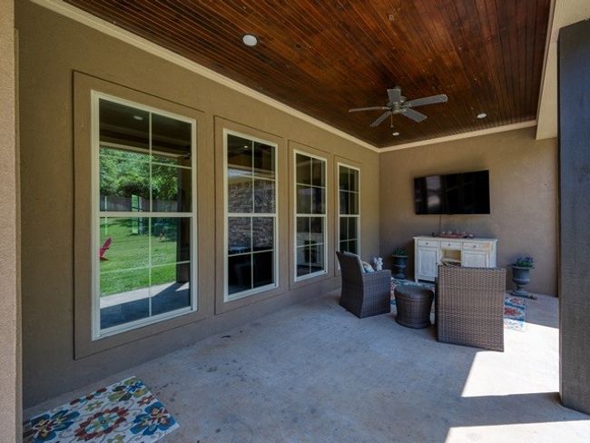 View of patio featuring a ceiling fan | Image 33