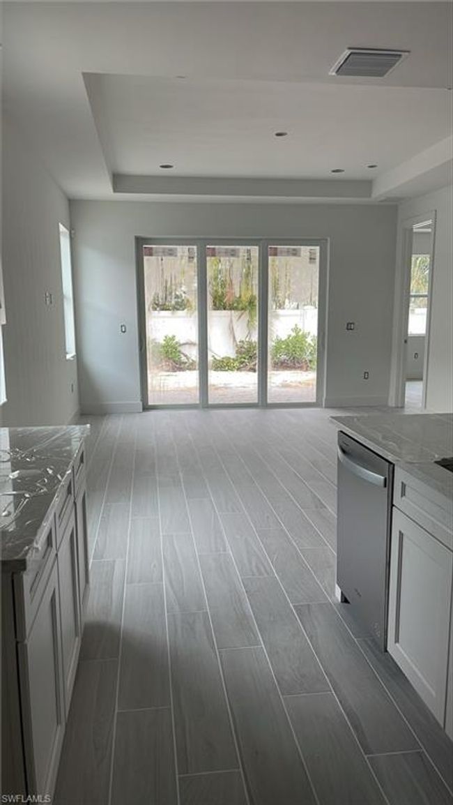 Standing in kitchen with view out to backyard | Image 6