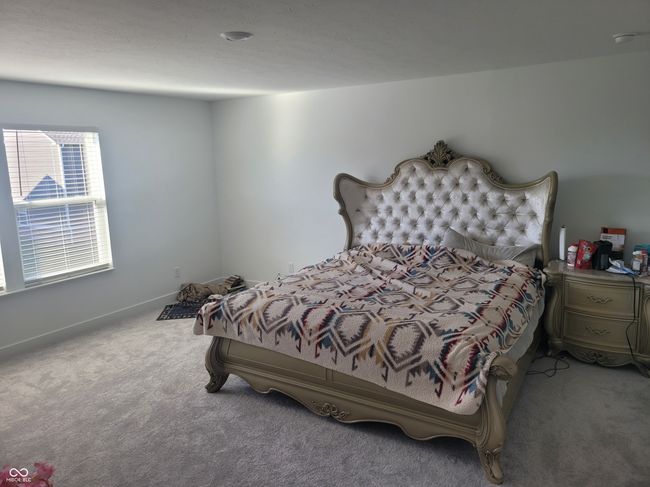 bedroom with carpet and baseboards | Image 9