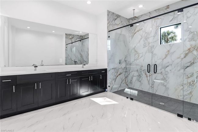 Bathroom featuring walk in shower and dual bowl vanity | Image 24