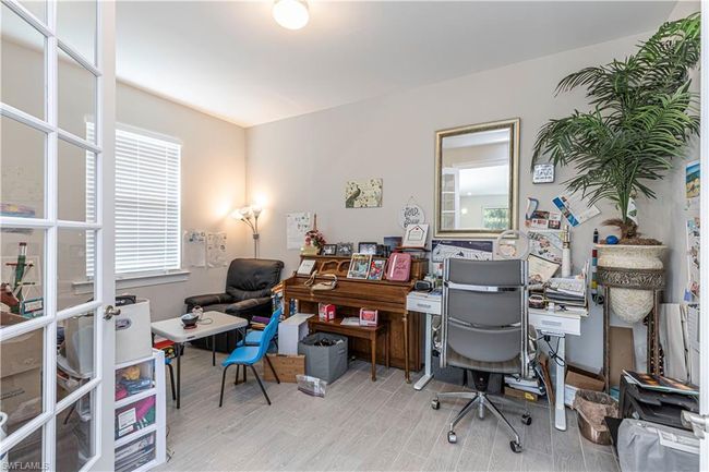 Office featuring light wood-style flooring | Image 14