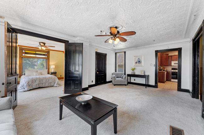 Main level living room with views of the Mississippi River | Image 6