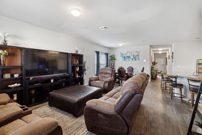 Living area with wood-vinyl finished floors | Image 23