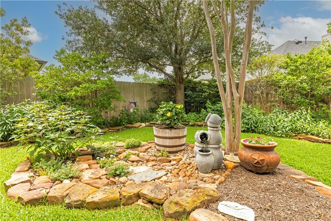 View of fenced backyard | Image 33