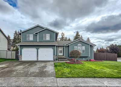 Great floorplan & driveway nicely expanded for 3rd vehicle. | Image 1