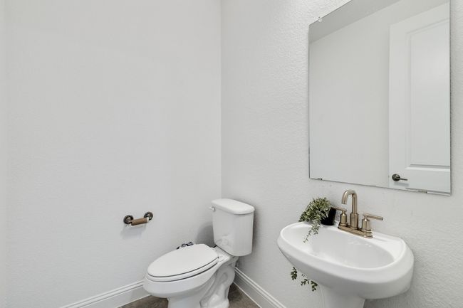 Bathroom featuring toilet and sink | Image 27