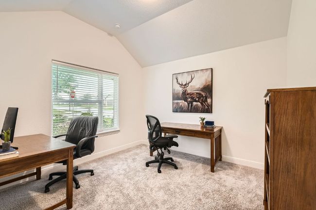 Carpeted office featuring lofted ceiling and baseboards | Image 14