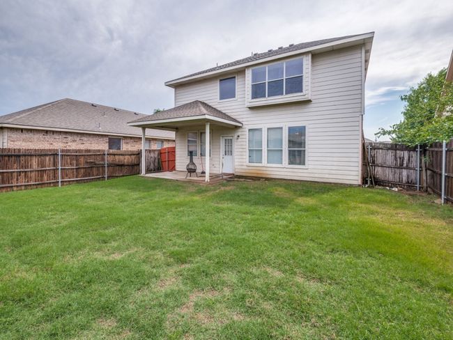 Back of house featuring a patio, a lawn, and a fenced backyard | Image 25