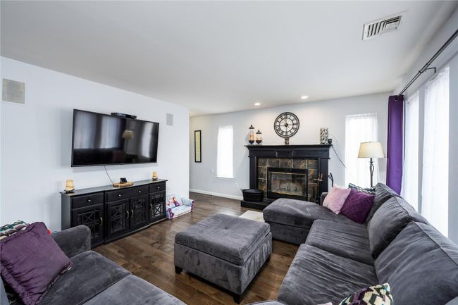 Living room with dark hardwood / wood-style flooring | Image 8