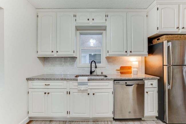 Window above kitchen sink and garbage disposal | Image 7
