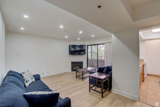 Living room with light hardwood / wood-style floors | Image 4