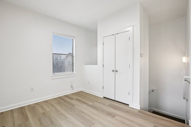 Check out these fresh new floors! This is the upstairs area that can be used as you would like. Some ideas are an office or dining room. It offers a spacious closet for storage. | Image 7