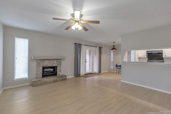 Cozy Living room with a stone fireplace | Image 9