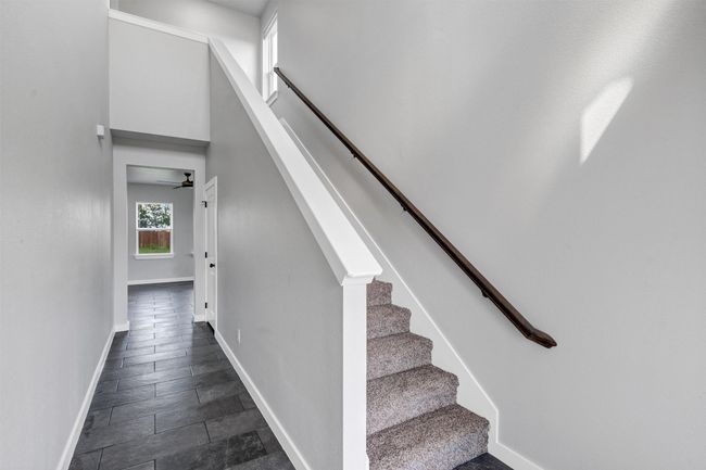 Stairway with baseboards and ceiling fan | Image 6