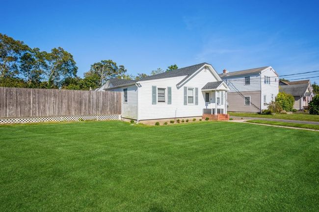 View of front of property with fence and a front lawn | Image 19
