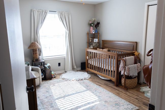 Bedroom featuring a nursery area and wood finished floors | Image 20
