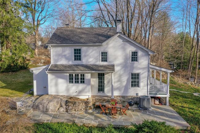 Side view of the house with flagstone patio | Image 27