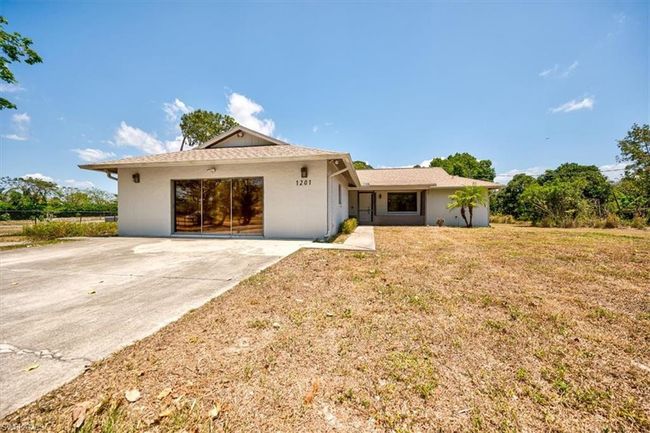 Ranch-style house featuring a front lawn | Image 4