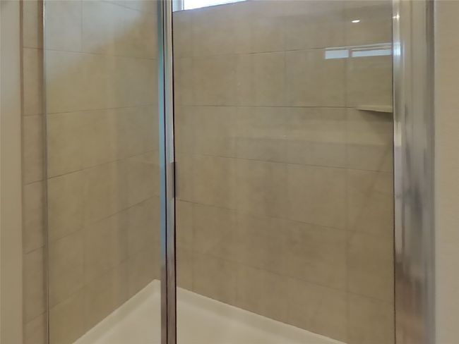 Full bathroom featuring a tile shower | Image 8