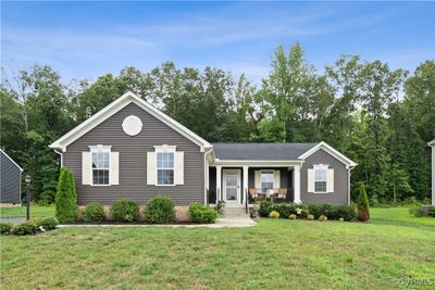 View of front of home featuring a front lawn and a porch | Image 1