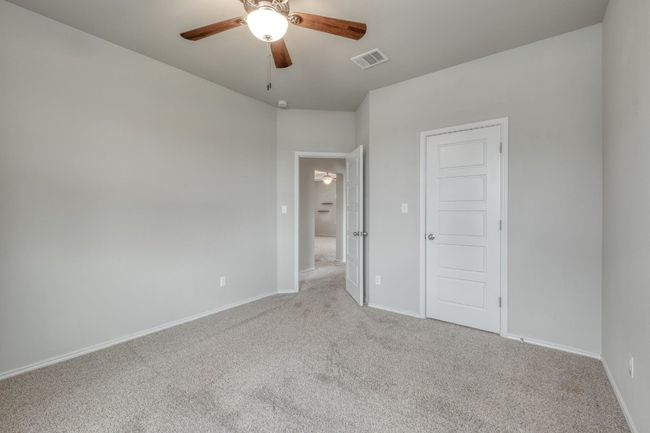 Unfurnished bedroom featuring carpet floors and a ceiling fan | Image 25