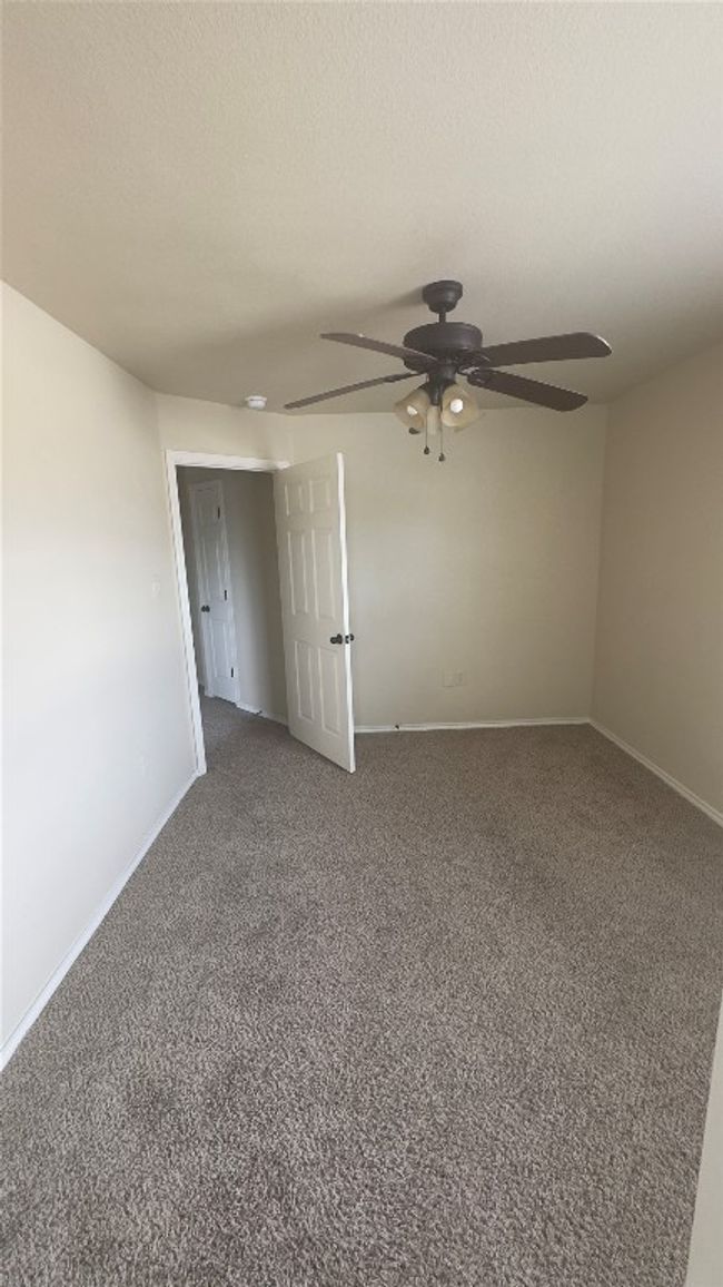 Unfurnished room featuring ceiling fan and carpet flooring | Image 12