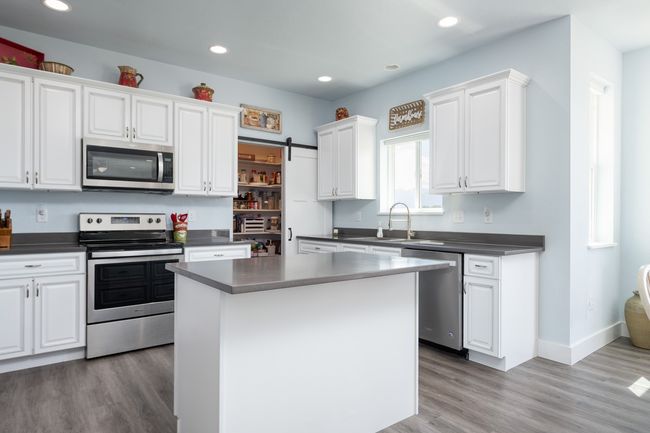 Quartz counters. Island has drawers. | Image 4