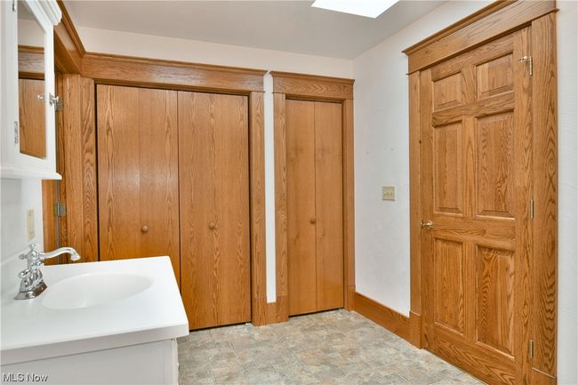 Bathroom with tile floors and vanity | Image 21